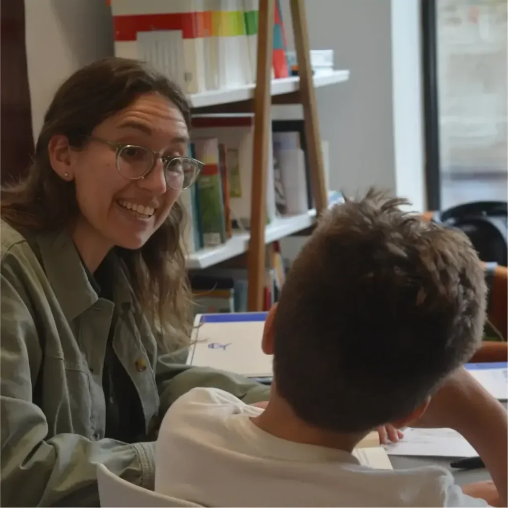 Redwood instructor smiling with a student during a one to one lesson
