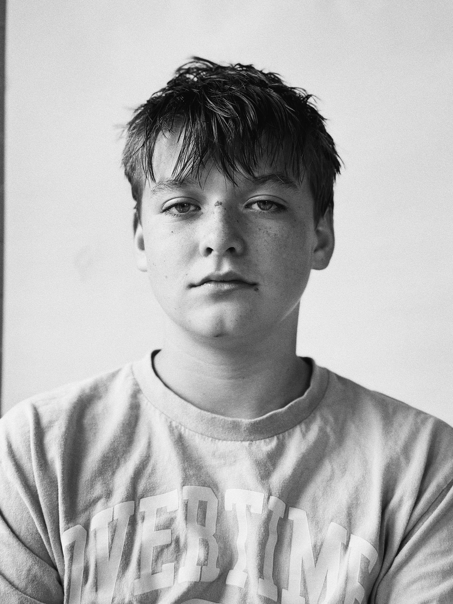 Redwood Literacy dyslexia tutoring student in Nashville, calm expression, graphic tee, black and white